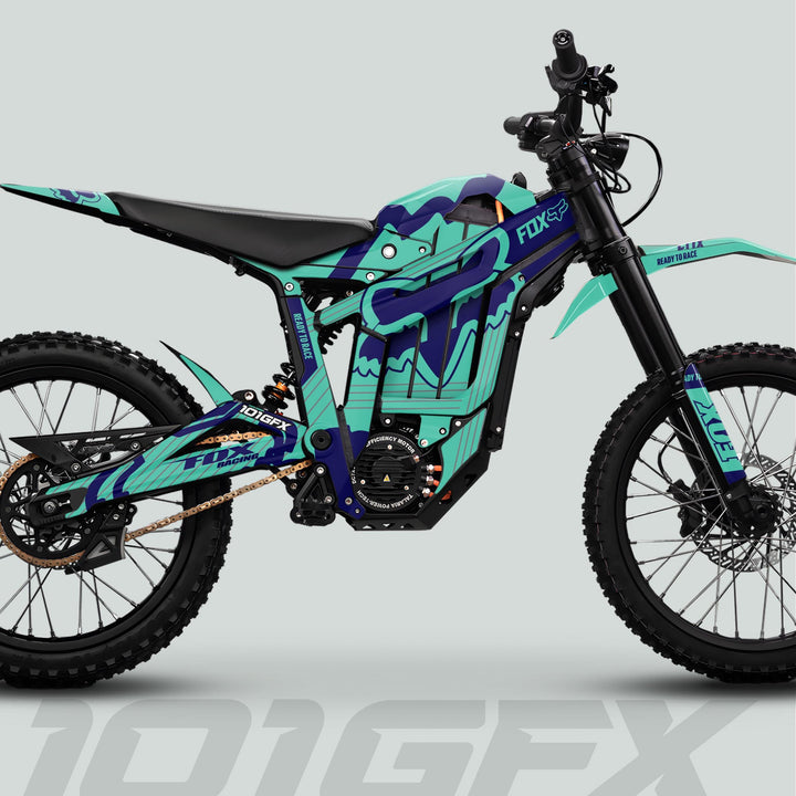 Talaria Sting MX5 PRO Graphics Kit FOX STRIPES features teal-and-blue race graphics with Fox suspension, enhancing your e-dirt-bike's style and protection.