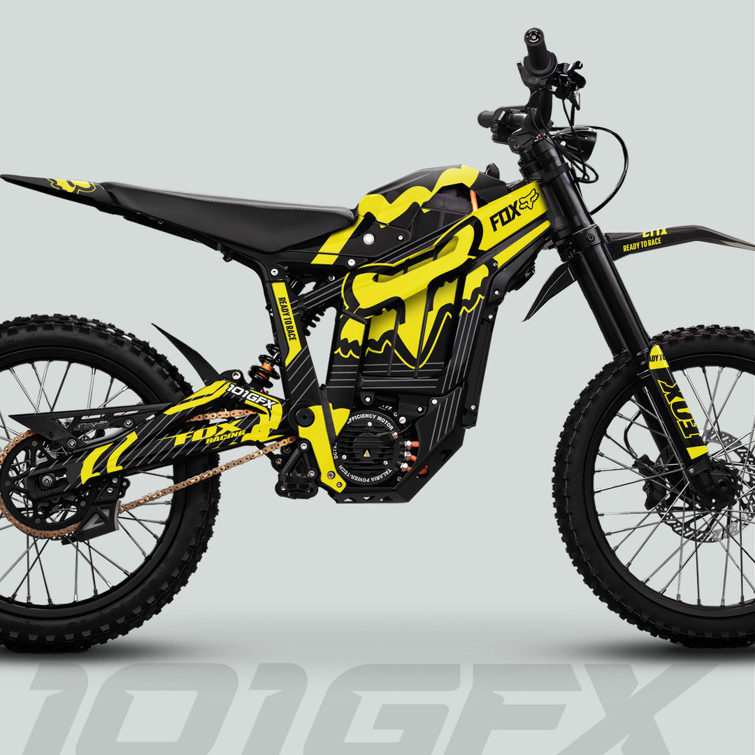 Talaria Sting MX5 PRO Graphics Kit FOX STRIPES: Black-yellow livery on an electric dirt bike with FOX Racing design, featuring knobby tires and long-travel suspension.