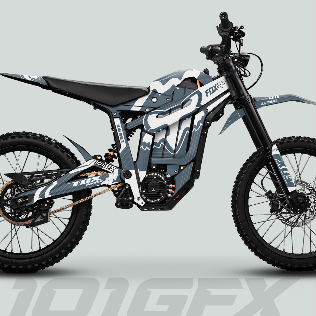 Talaria Sting MX5 PRO Graphics Kit FOX STRIPES Grey White Decals on an electric off-road bike, enhancing its aesthetic with durable, stylish Fox Racing designs.
