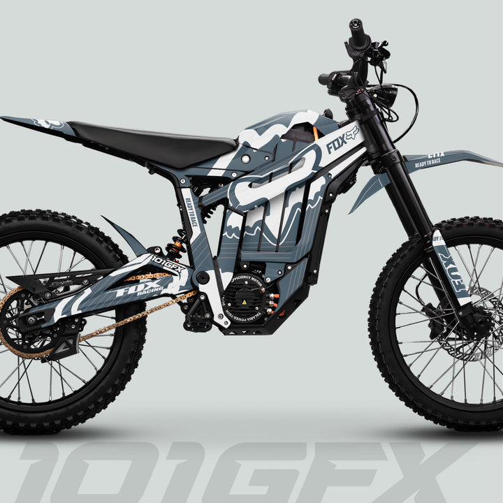 Talaria Sting MX5 PRO Graphics Kit FOX STRIPES Grey White Decals on an electric off-road bike, enhancing its aesthetic with durable, stylish Fox Racing designs.