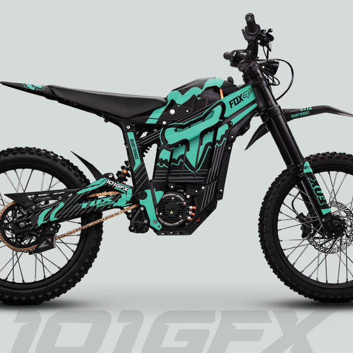 Talaria Sting MX5 PRO Graphics Kit FOX STRIPES Black Mint Decals on electric dirt bike, featuring teal-and-black design, knobby tires, suspension, and central battery.