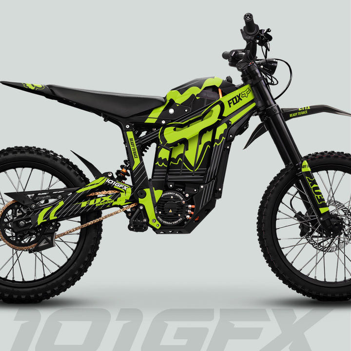 Talaria Sting MX5 PRO Graphics Kit, featuring FOX STRIPES decals on a black and neon-green electric dirt bike, showcasing knobbly tires and suspension.