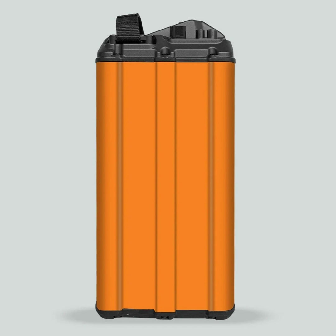 Surron Light Bee X Battery Stickers SOLID Orange on a tall, rectangular battery module with black caps and pull-strap, enhancing style and protection.