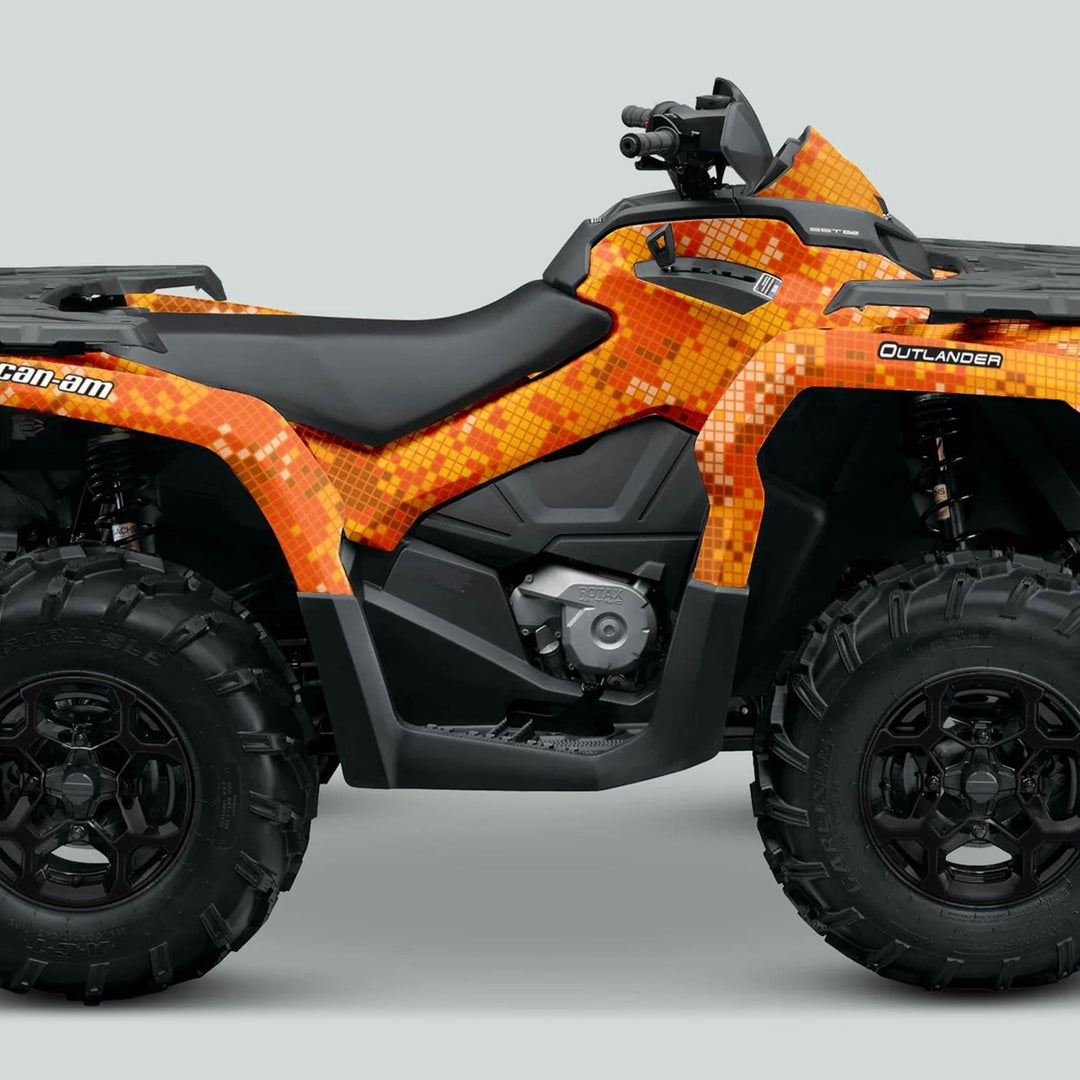 Can-Am OUTLANDER Graphics Kit DIGITAL CAMO Orange on an ATV, showcasing a vibrant pixel-camo wrap with durable vinyl for style and protection.