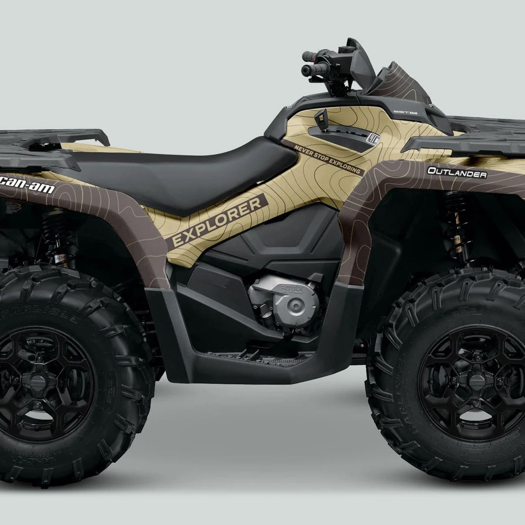 Can-Am OUTLANDER G2 Graphics Kit EXPLORER Sand Earth on ATV, featuring topographic graphics and Never Stop Exploring text, enhancing style and protection.