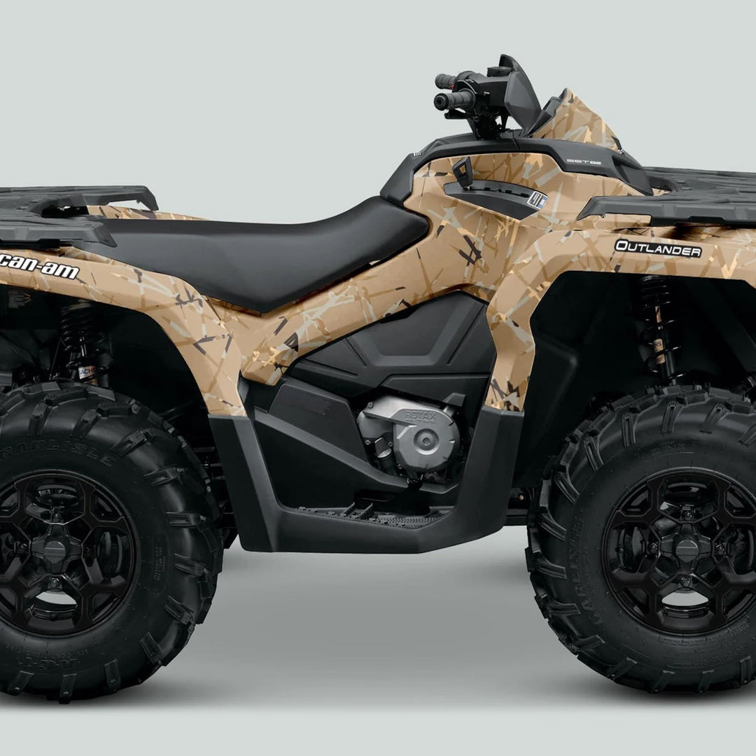 Side-profile of a Can-Am Outlander ATV with a tan-and-brown desert camo wrap, showcasing the Can-Am OUTLANDER G2 Graphics Kit SCRATCHY SAND.