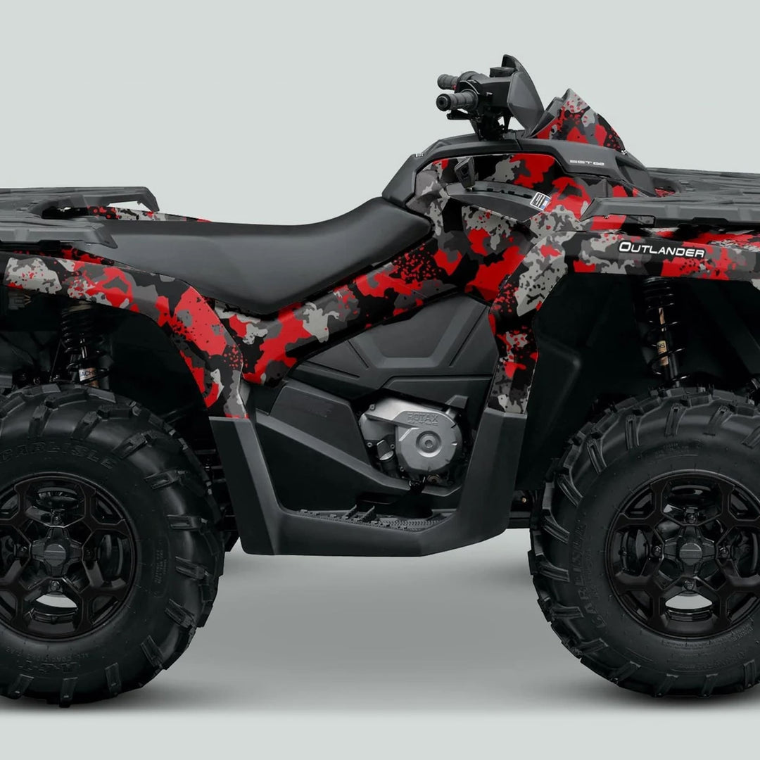 Can-Am OUTLANDER Graphics kit SPLAT CAMO Red shown on ATV with large off-road tires and single rider’s seat, highlighting its durable, custom-fit design.
