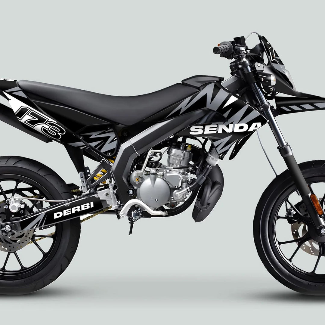Derbi Senda Graphics Kit X-Treme 2011-2017 LIGHTNING BLACK GREY on a supermoto-style motorcycle, highlighting the sleek, protective design and precise fit on the bike.