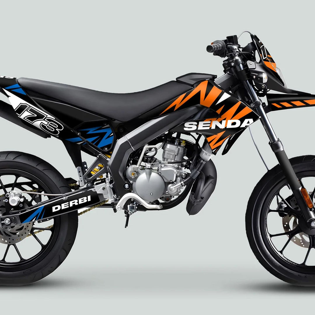 Derbi Senda Graphics Kit X-Treme 2011-2017 enhances a motorcycle with black/orange/blue graphics, offering a precision fit and durable vinyl for Derbi Senda models.