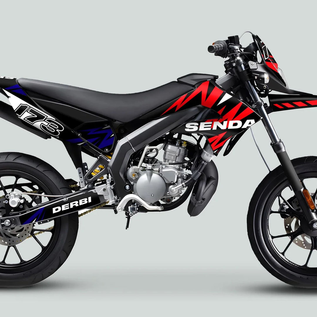 Derbi Senda Graphics Kit X-Treme 2011-2017 LIGHTNING RED NAVY on a black-framed dirt bike with red-blue decals, enhancing style and durability.
