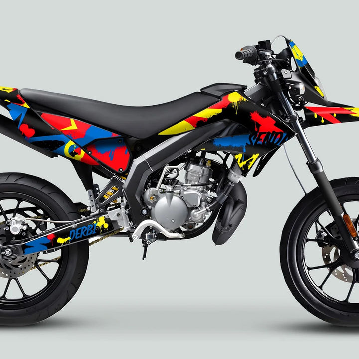 Derbi Senda Graphics Kit X-Treme 2011-2017 SPLASH BLUE RED on a sport-style motorcycle, showcasing vibrant graffiti-inspired decals over a sleek black frame.