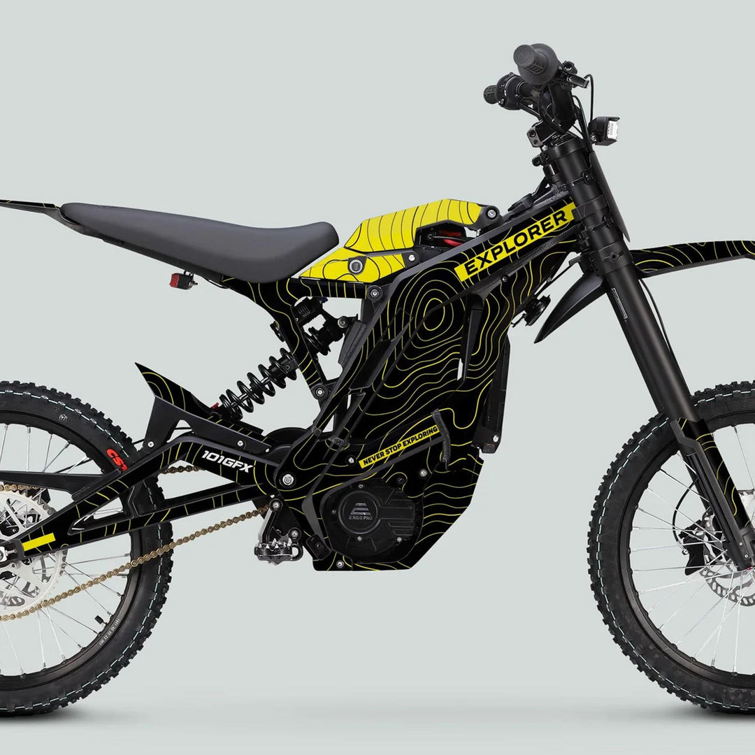 Side profile of E Ride Pro SS Graphics Kit EXPLORER Black Yellow on electric off-road bike, highlighting the durable frame, knobby tires, and distinct graphics.