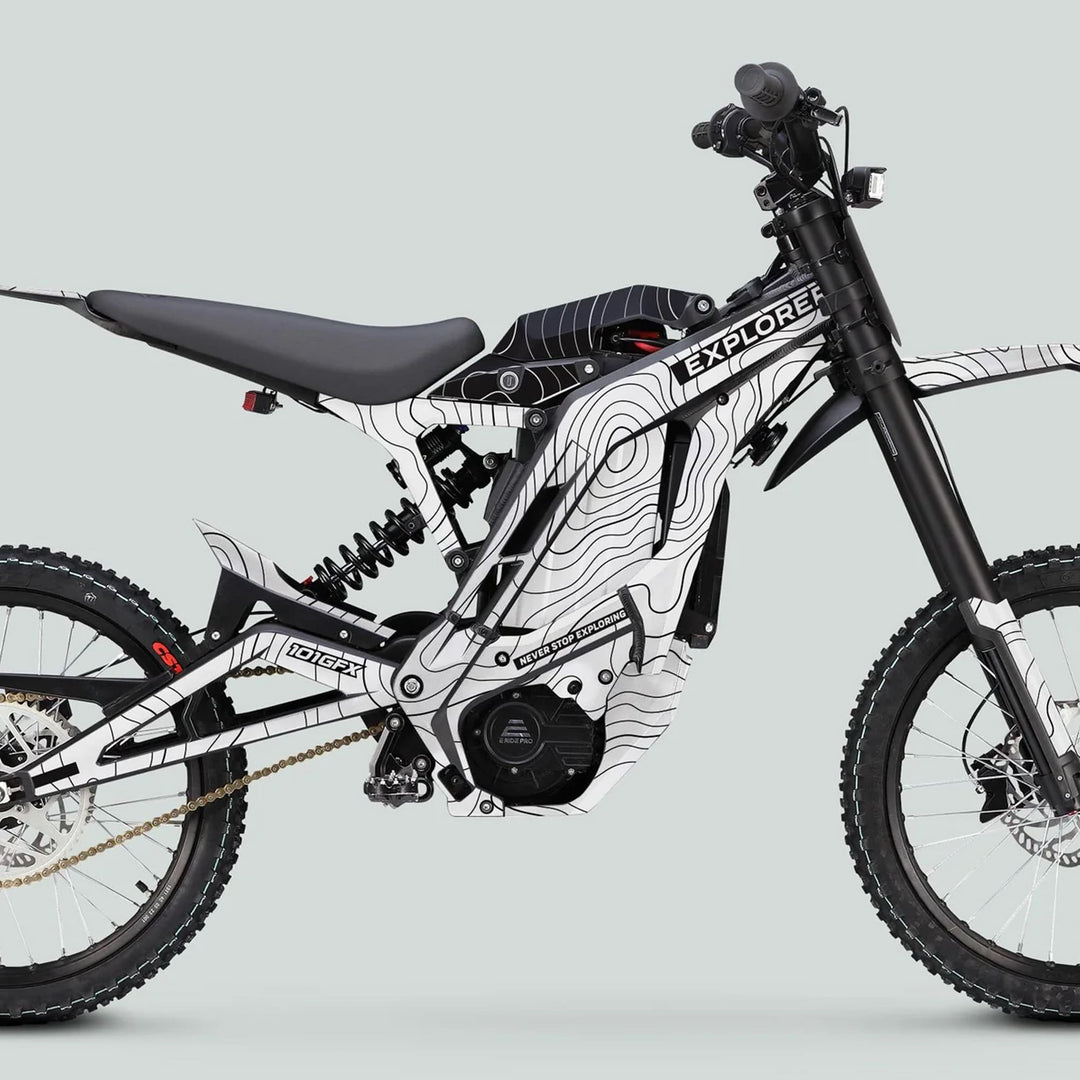 E Ride Pro SS Graphics Kit EXPLORER: Full-sized e-dirt bike with black and white contour-map graphics, dual-suspension, knobby tires, and mid-mounted motor.