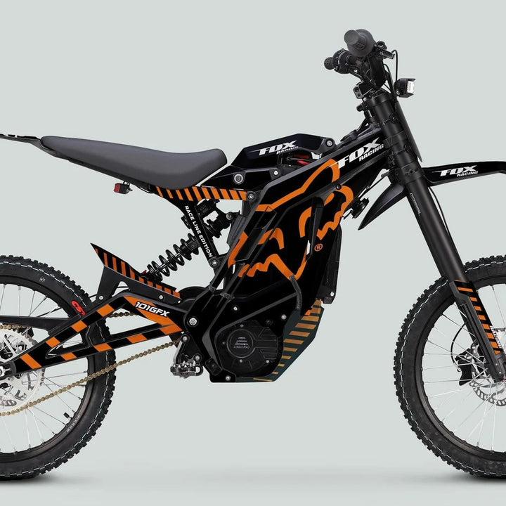 Side view of the E Ride Pro SS Graphics Kit FOX Race Line Black Orange on an electric off-road dirt bike, showcasing its bold design and durable fit.