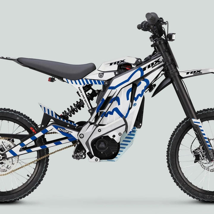 E Ride Pro SS Graphics Kit FOX Race Line on an electric dirt bike, showcasing white-and-blue decals, Fox Racing branding, and sleek design elements.