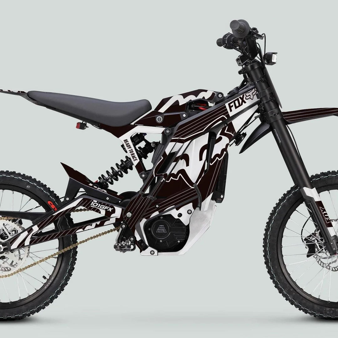E Ride Pro SS Graphics Kit FOX R Stripes on electric dirt bike with knobby tires and race-style seat, enhancing vehicle aesthetics and durability.
