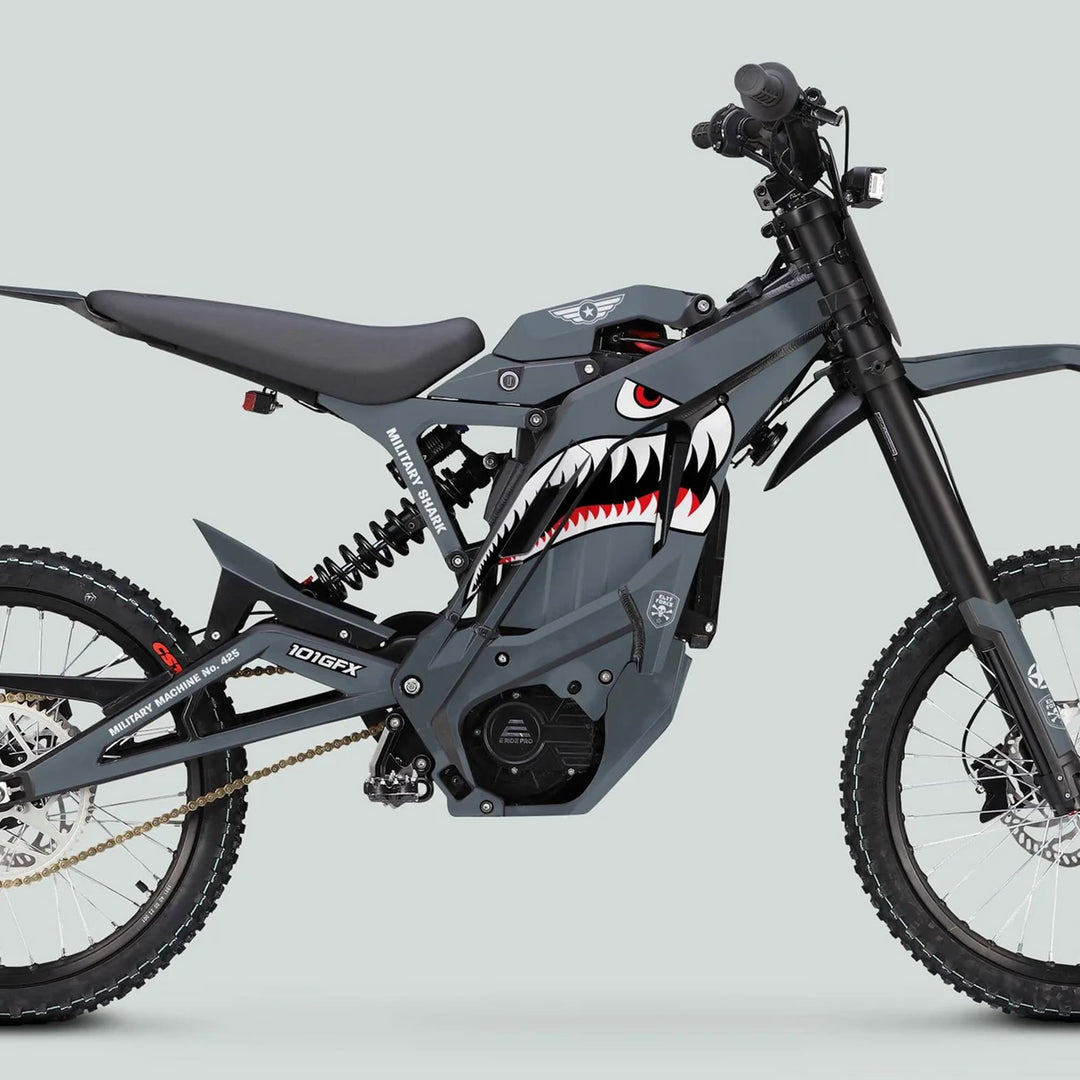 E Ride Pro SS Graphics Kit MILITARY SHARK Grey on electric dirt bike, featuring shark mouth design, tubular frame, knobby tires, and rear suspension.