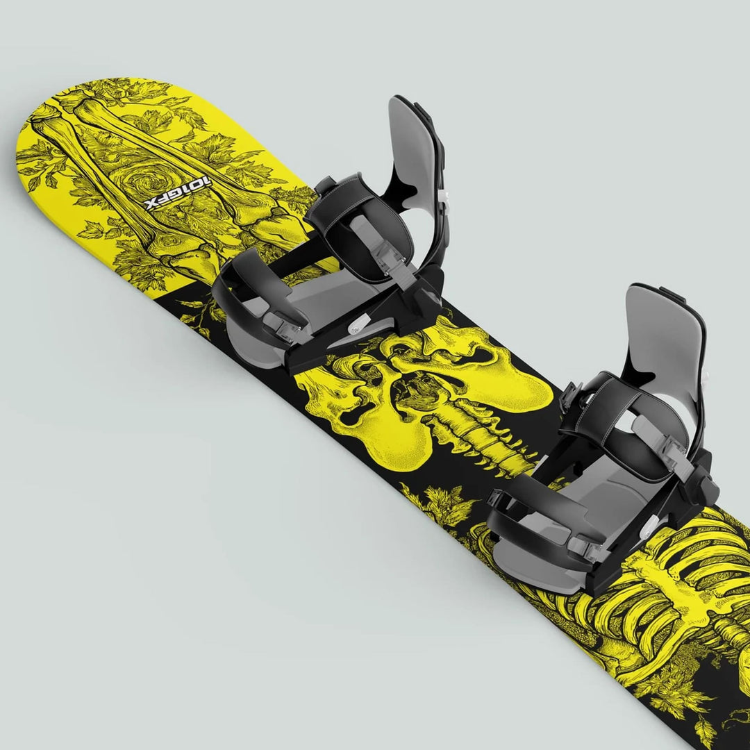 Snowboard with Snowboard Wrap RIDER FOREVER YELLOW, featuring anatomical skeleton motif and strap-in bindings, enhancing style and protection on the slopes.