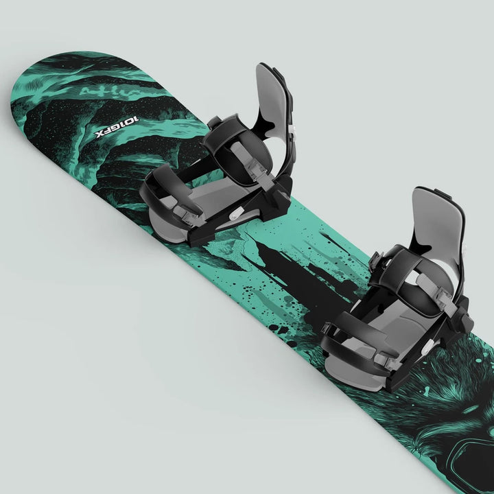 Snowboard with SNOWER MINT sticker skin, featuring teal-and-black graphics and black bindings, designed for durability and style on the slopes.
