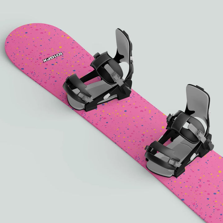 Snowboard Wrap SPLATS PINK with mounted black/gray bindings, featuring vibrant splatter graphics, designed for snowboard protection and style enhancement.