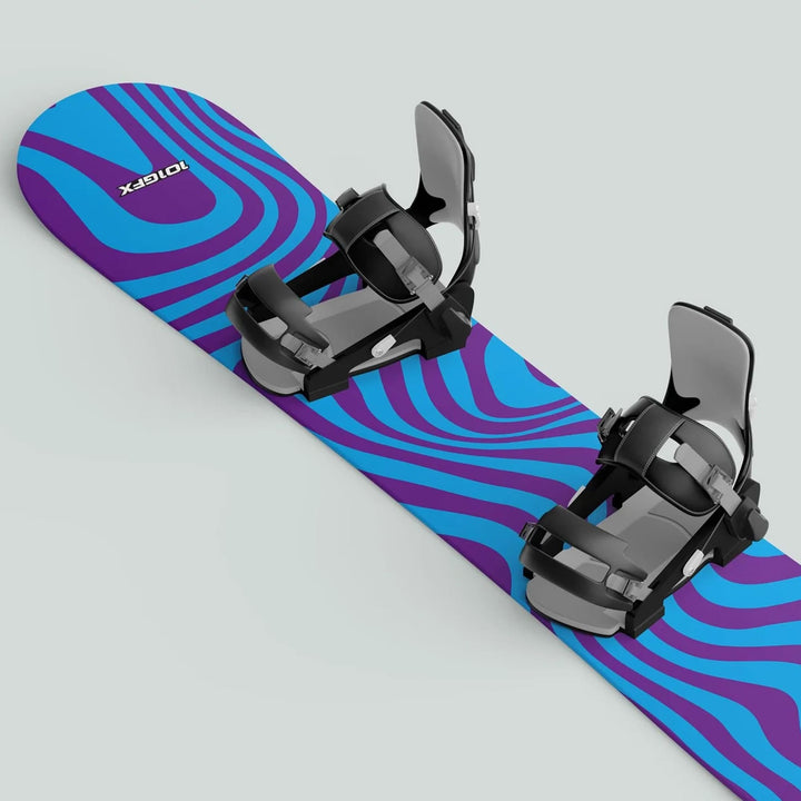 Snowboard with Snowboard Wrap WAVY CYAN PURPLE sticker, featuring a wavy graphic and fitted with black adjustable bindings for front and rear feet.
