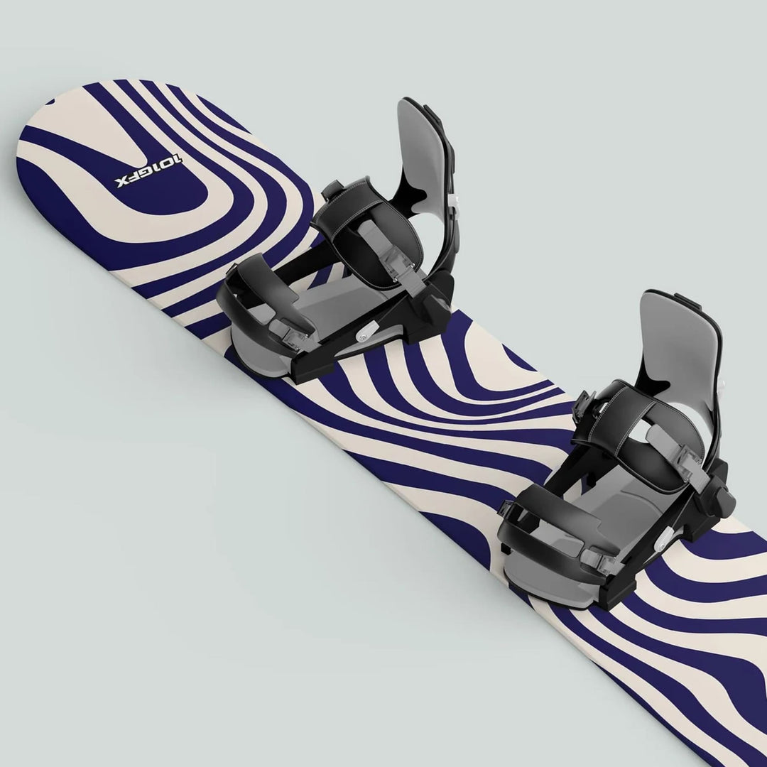 Snowboard with cream-and-navy wavy stripe design featuring black-and-gray bindings, showcasing Snowboard Wrap WAVY WHITE NAVY sticker decals for style and protection.