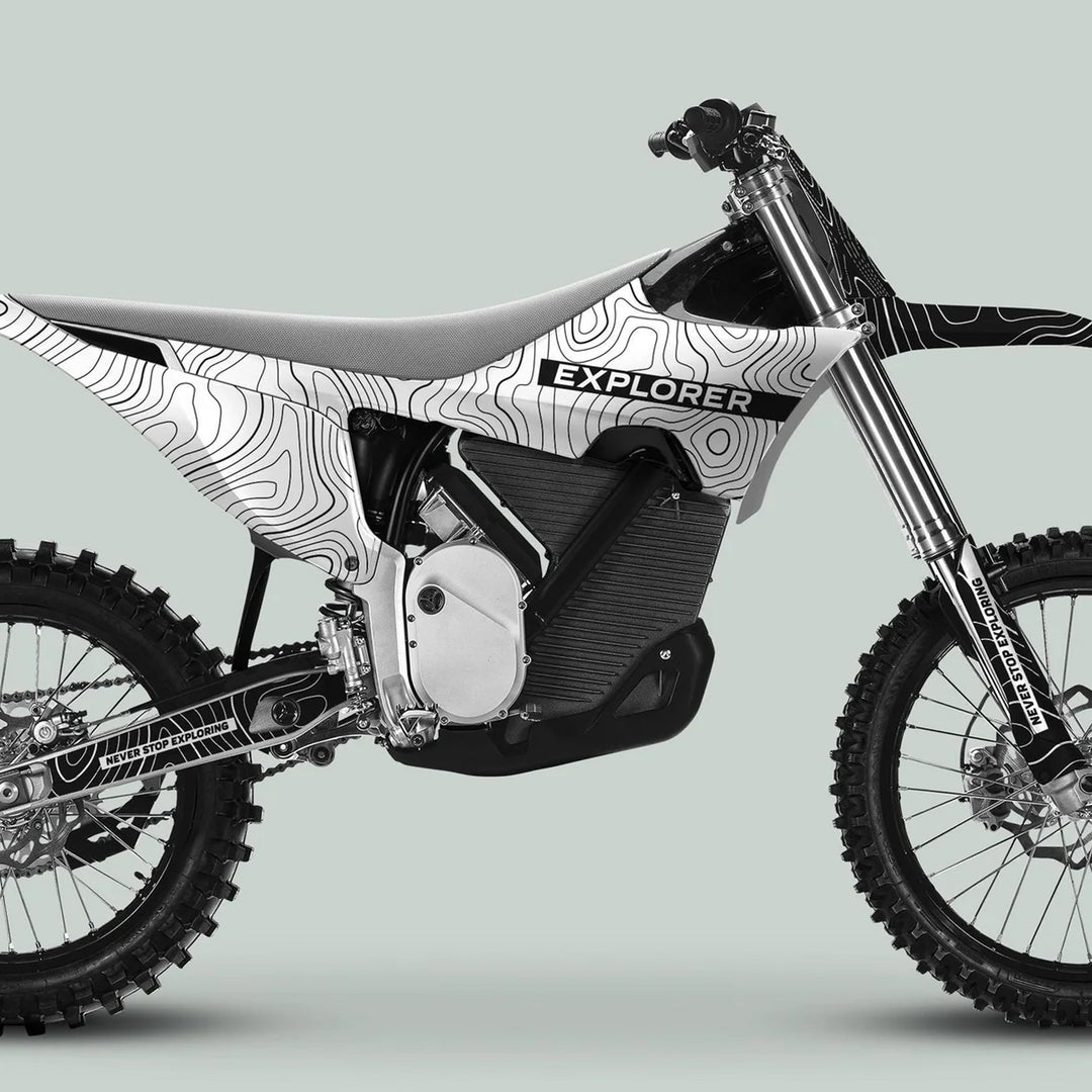 Stark Varg Graphics Kit EXPLORER WHITE BLACK, featuring topographic-map patterns and EXPLORER text, elevates your off-road dirt bike with durable, stylish vinyl decals.