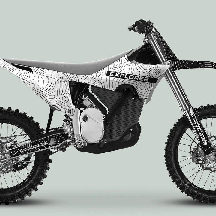 Stark Varg Graphics Kit EXPLORER WHITE BLACK, featuring topographic-map patterns and EXPLORER text, elevates your off-road dirt bike with durable, stylish vinyl decals.