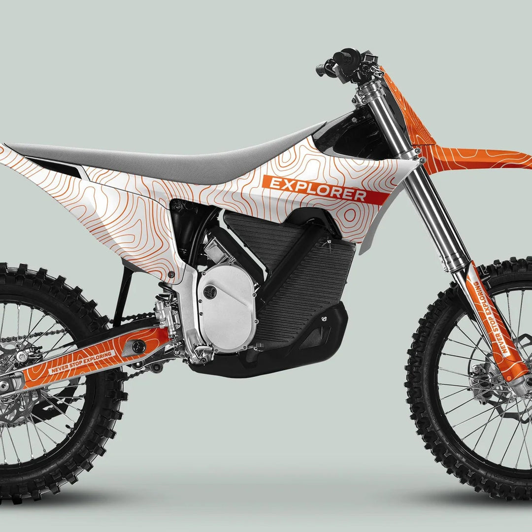 Stark Varg Graphics Kit EXPLORER WHITE ORANGE on an electric dirt bike, showcasing durable decals, vivid topographic design, and NEVER STOP EXPLORING slogan on the swingarm.