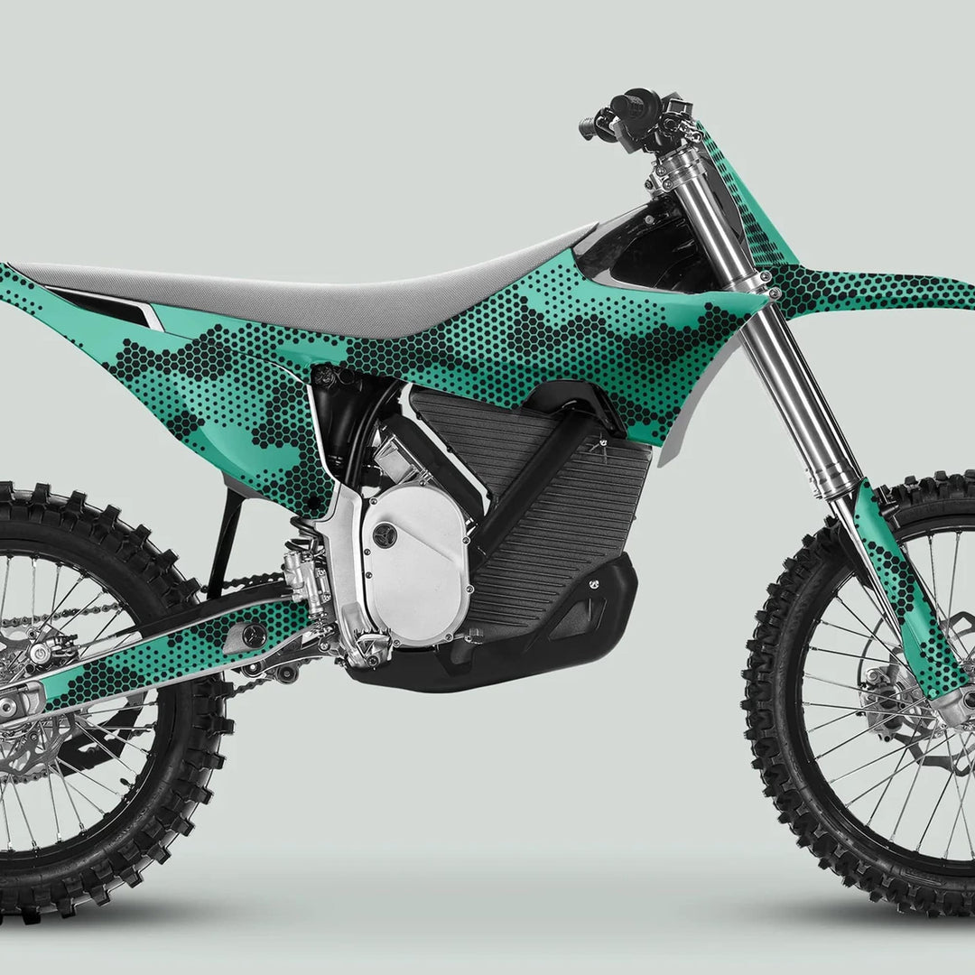 Stark Varg Graphics Kit HEXOCAM MINT Decals Stickers on an off-road bike, featuring teal-black camo design, electric motor setup, and durable frame enhancements.