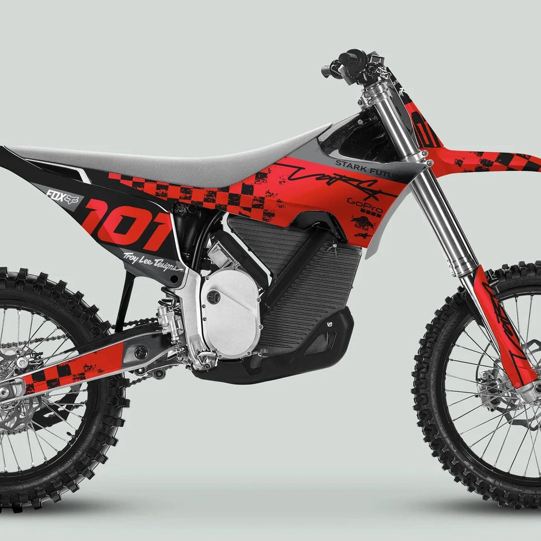 Side view of a dirt bike featuring Stark Varg Graphics Kit RACE BLACK Red Decals Stickers, showcasing sleek design, durable glossy finish, and bold red accents.