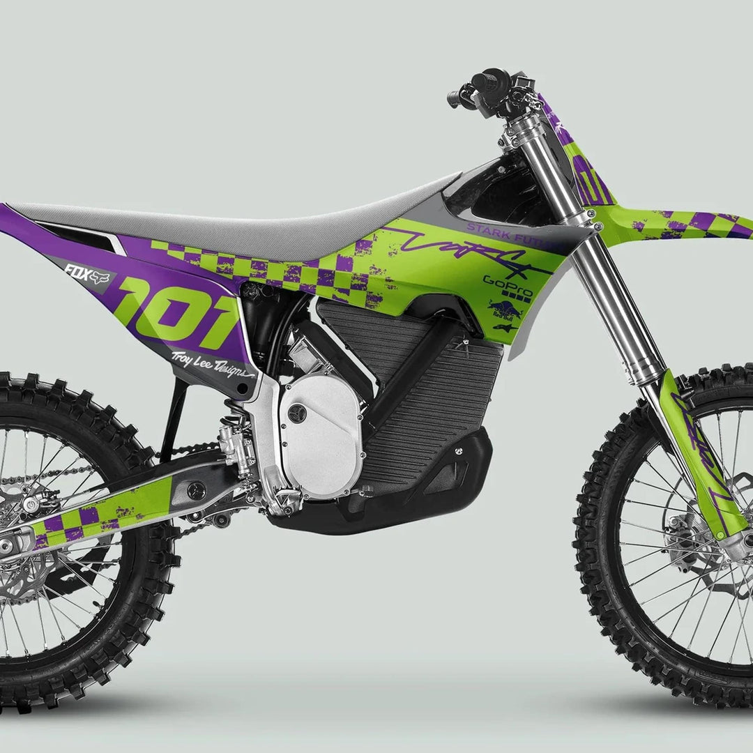 Stark Varg Graphics Kit RACE PURPLE Green Decals Stickers on a custom-liveried motocross bike, featuring race number 101 and various sponsor logos.
