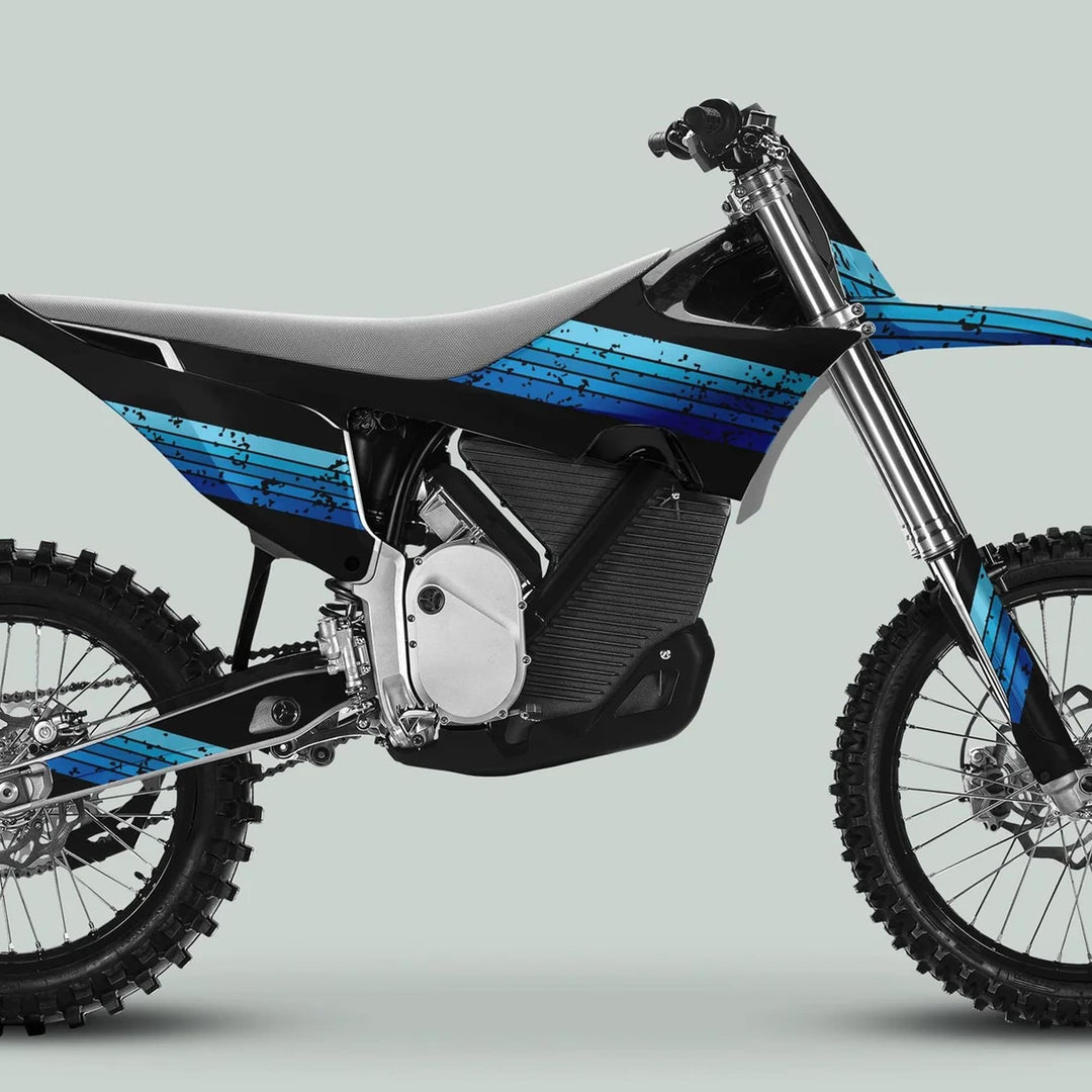 Electric dirt bike with Stark Varg Graphics Kit RETRO BLUE Decals, featuring knobby tires, inverted forks, slim seat, and blue-black striped body panels.