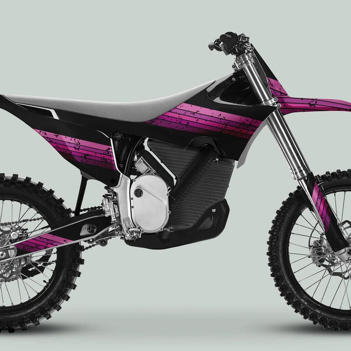 Side view of an electric dirt bike with Stark Varg Graphics Kit RETRO PINK Decals, featuring black panels and pink stripes for a vintage aesthetic.