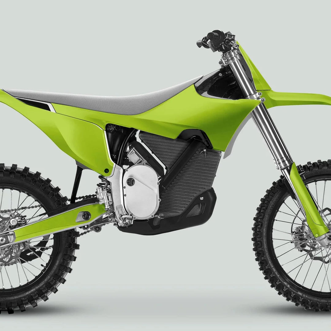 Stark Varg Graphics Kit SOLID COLOR GREEN Stickers on a lime-green dirt bike, showcasing vibrant decals enhancing its modern off-road appearance.