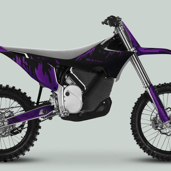 Side-profile of a modern off-road bike with Stark Varg Graphics Kit SOUL FLAME Black Purple Decals, showcasing its electric drivetrain, knobby tires, and stylish slogan.