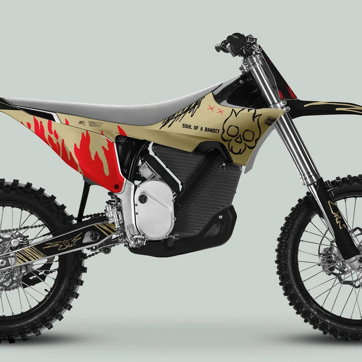 Stark Varg Graphics Kit SOUL FLAME Sand Red Decals on a motocross-style dirt bike, featuring red flames, skull motif, and sleek black-tan-red design.