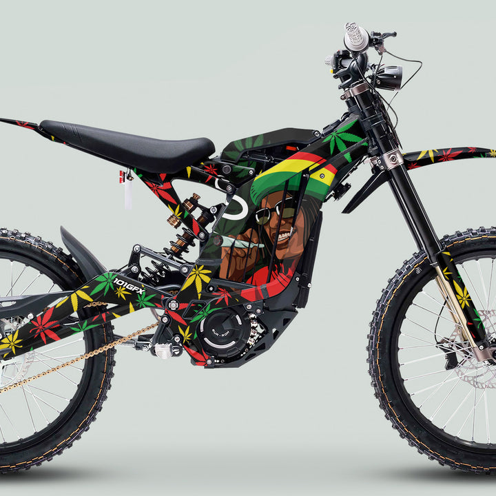 Sur Ron Light Bee X Graphics Kit Stickers Cannabis Style Red Green Yellow, featuring Rastafarian motifs and cannabis leaves on a custom electric dirt bike wrap.