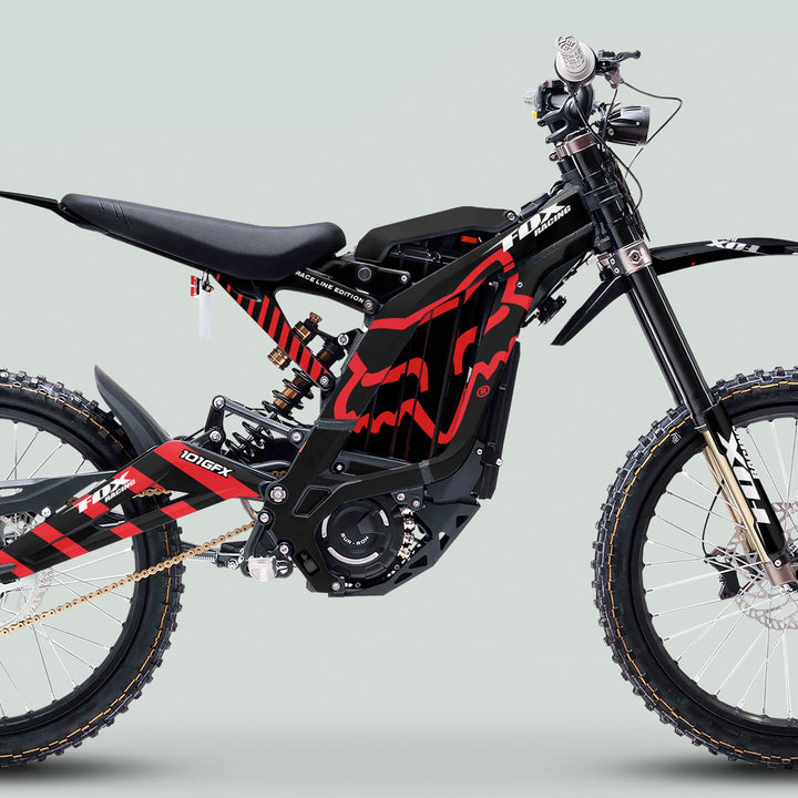 Surron Light Bee X Graphics Kit FOX RACE LINE Black Red on electric dirt bike, showcasing frame graphics, central battery, front suspension, and off-road tire.