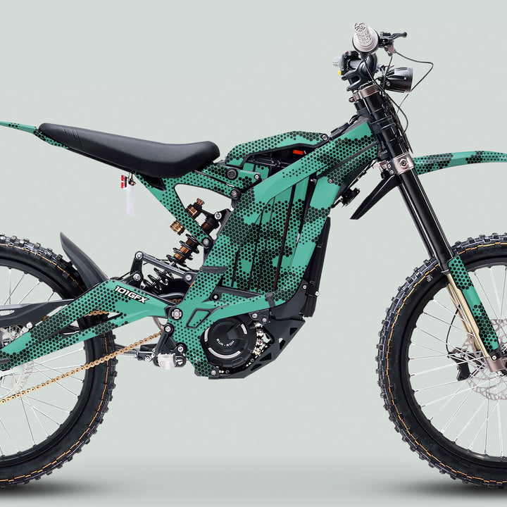 Side profile of a dirt bike featuring the Surron Light Bee X Graphics Kit HEXOCAM Mint with a hex-dot pattern on its tubular frame.