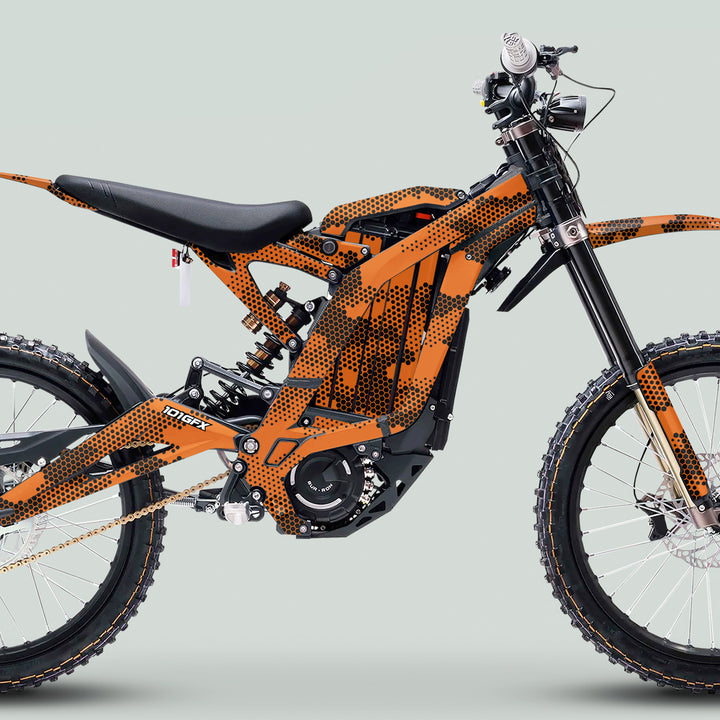 Surron Light Bee X Graphics Kit HEXOCAM Orange on a modern electric dirt bike, showcasing durable, easy-to-install vinyl for enhanced aesthetics and protection.