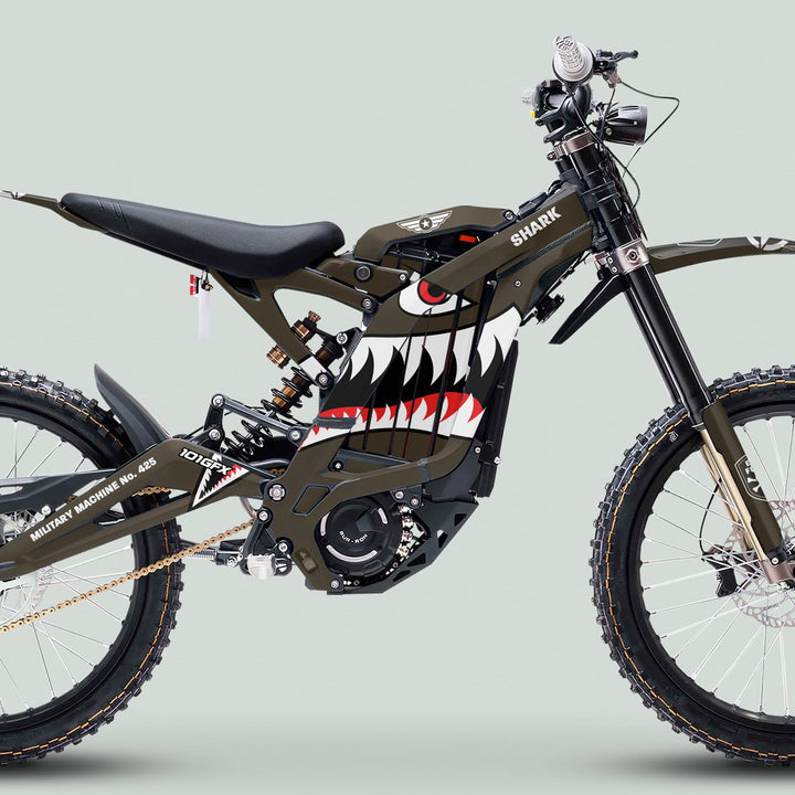 Surron Light Bee X Graphics Kit MILITARY SHARK Brown on a pit bike, featuring shark-mouth art, military stencils, and rugged design elements, enhancing durability and style.