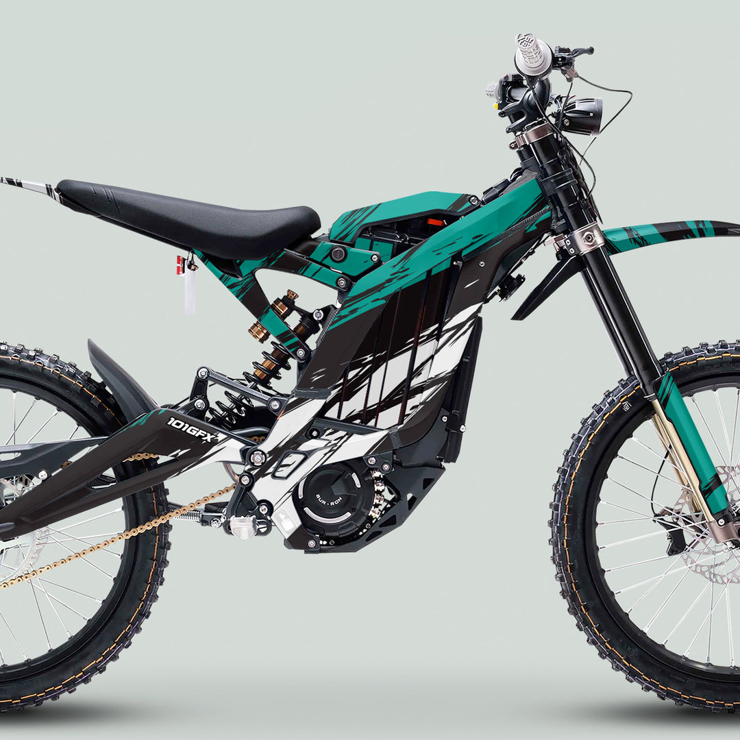 Surron Light Bee X Graphics Kit SLICE BLACK Mint on electric dirt bike, showcasing knobby tires, suspension, and motor, designed for style and durability.