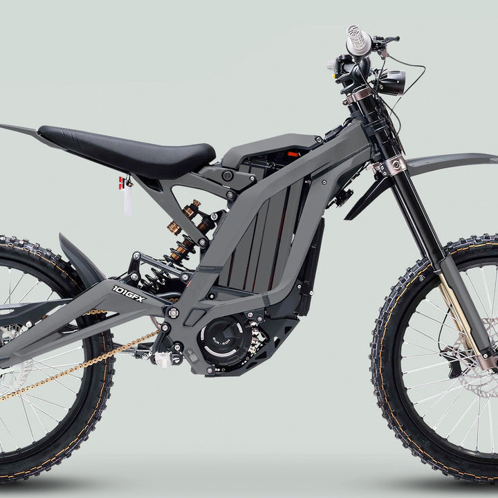 Surron Light Bee X Graphics Kit MONO COLOR Grey on an electric dirt bike featuring large knobby tires, exposed frame, and central battery, enhancing style and protection.