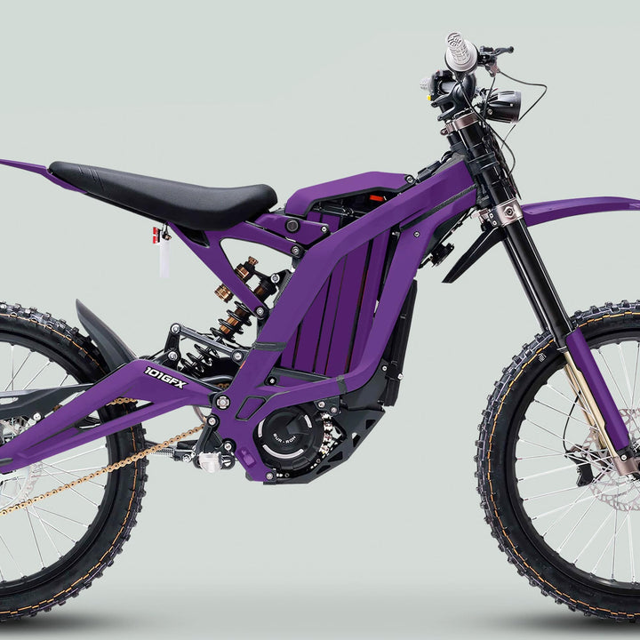 Surron Light Bee X Graphics Kit in vibrant purple on an off-road e-motorcycle; features rugged design, durable laminated decals, and easy application.