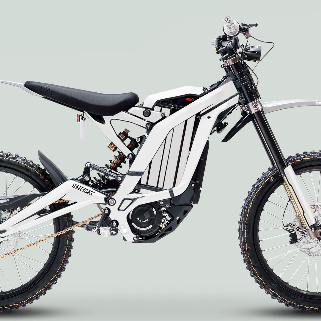 Surron Light Bee X Graphics Kit MONO COLOR White enhances a white electric dirt bike's rugged design, featuring durable decals fitting seamlessly over its minimalist frame and components.