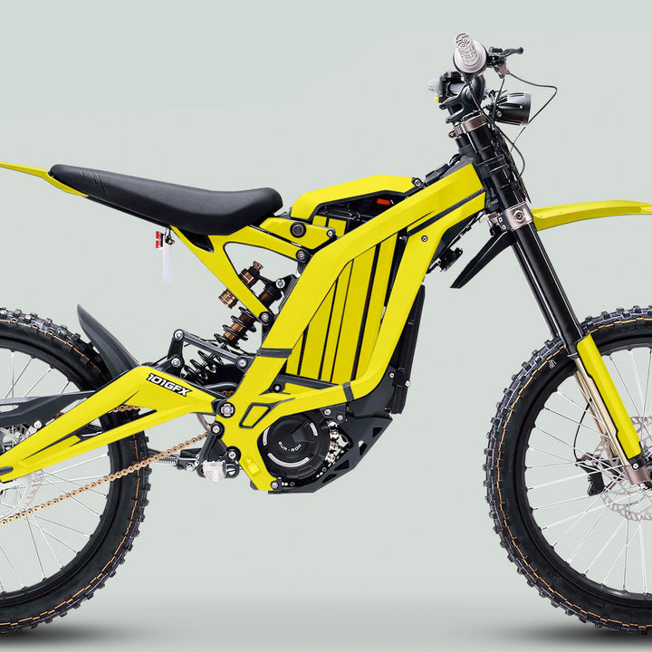 Surron Light Bee X Graphics Kit MONO COLOR Yellow on a dirt bike, showcasing knobby tires, boxed frame, and minimalist bodywork for trail use.