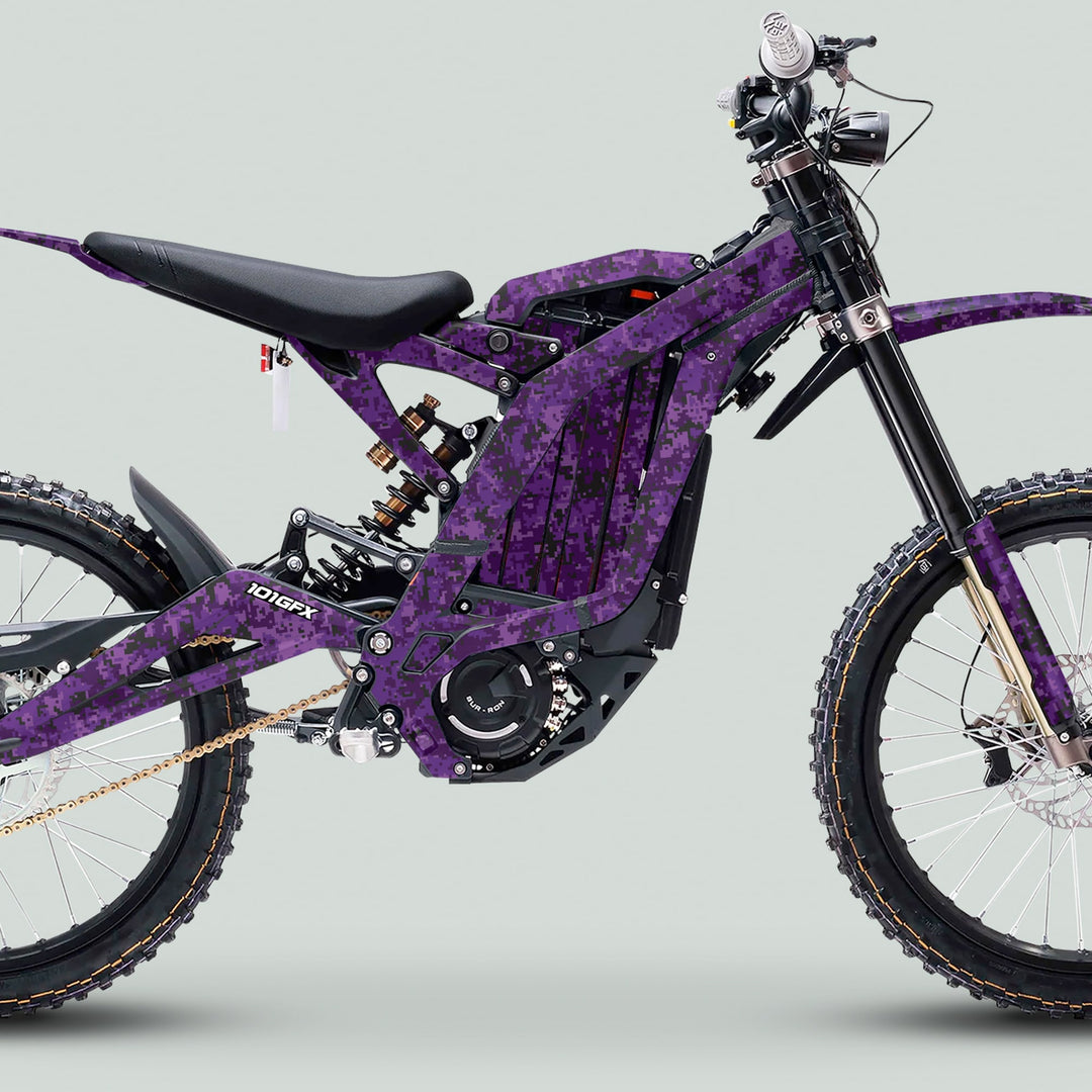 Surron Light Bee X Graphics Kit SQUARE TEK Purple on e-dirt bike showcases vibrant, glossy stickers enhancing style and durability with easy installation for a standout ride.