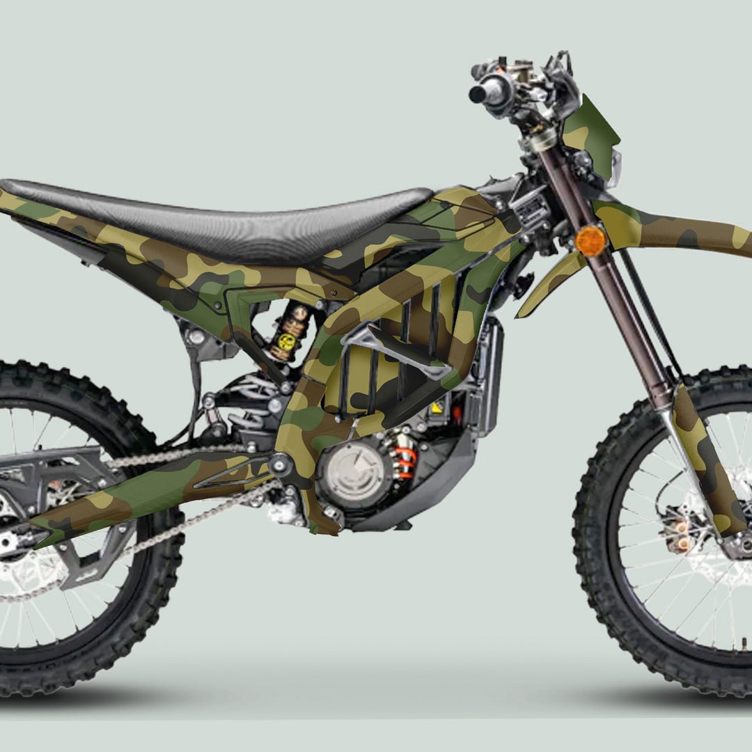 Surron Ultra Bee Graphics Kit CAMOUFLAGE Military design on a dirt bike, showcasing knobby tires, camo-wrapped components, and a protective glossy finish.