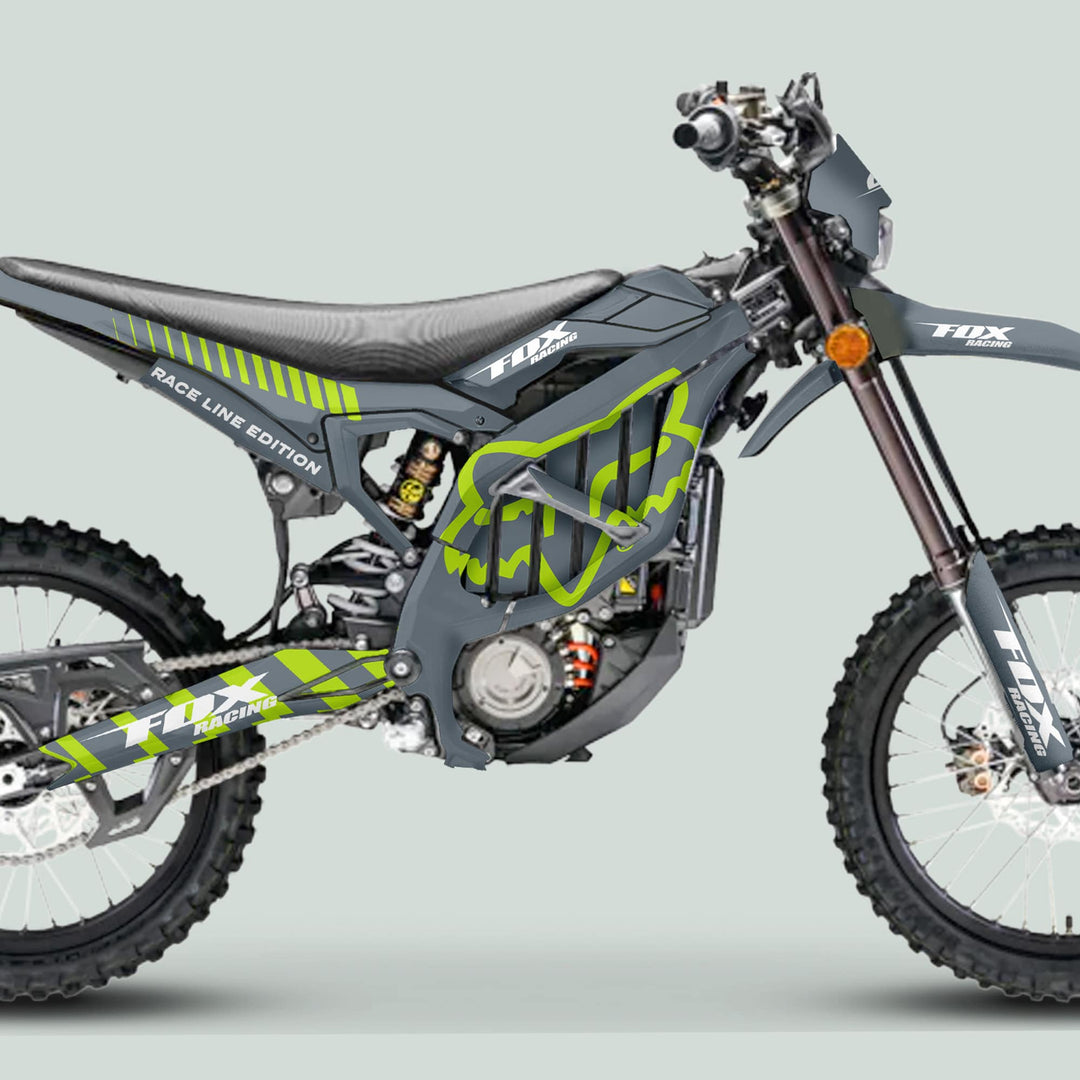 Surron Ultra Bee Graphics Kit FOX RACE LINE Grey Green on modern dirt bike, showcasing custom Fox Racing decals, knobby tires, and advanced suspension.